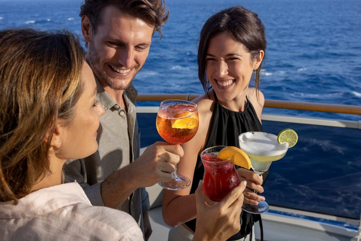 People with drinks onboard a MSC Cruises ship